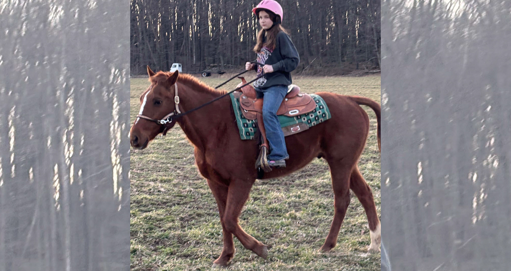 Girl riding horse